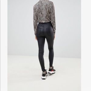 Black coated skinny jeans